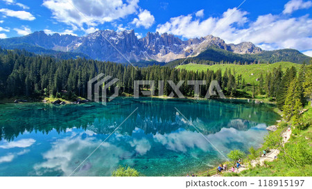 Italy Idyllic nature scenery- trasparent mountain lake Carezza surrounded by Dolomites rocks- one of the most beautiful lakes of Alps. South Tyrol region.  118915197