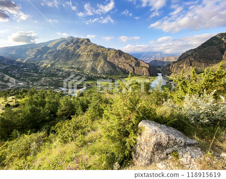 Beautiful view of the valley in the mountains with a river on a sunny summer day. Dagestan 118915619