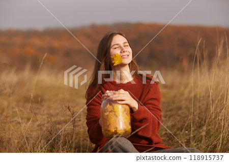 girl enjoying warm autumn in the park, hello autumn, autumn mood girl enjoying warm autumn in the park, hello autumn, autumn mood 118915737