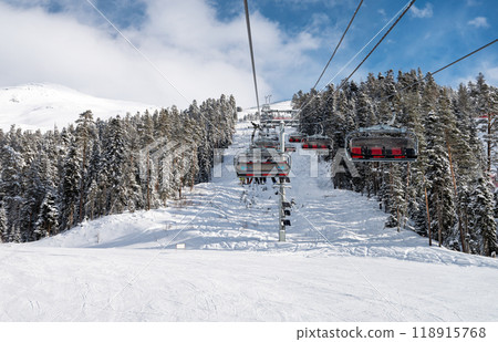 Beautiful landscape of the Arkhyz ski resort with mountains, rorest, snow and a cable car  118915768