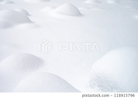 Snowy landscape with rounded hills, smooth texture and untouched snow. Concept for design Snowy landscape with rounded hills, smooth texture and untouched snow. Concept for design 118915796