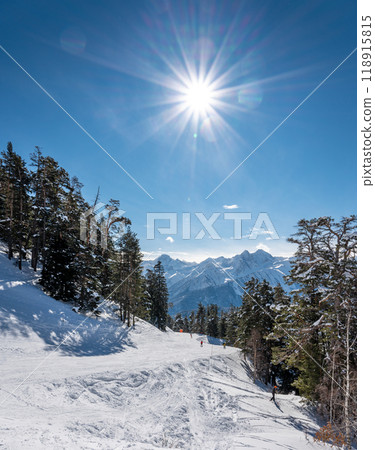 Beautiful landscape of the Arkhyz ski resort with mountains, snow, forest, skiers and snowboarders   118915815