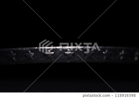 Coin edge, metallic silver star, metal in the darkness Coin edge, metallic silver star, metal in the darkness 118916398