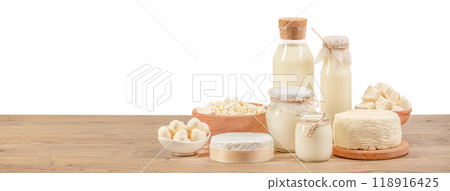 Different fresh dairy products on a wooden table isolated on white background. clipping path included 118916425