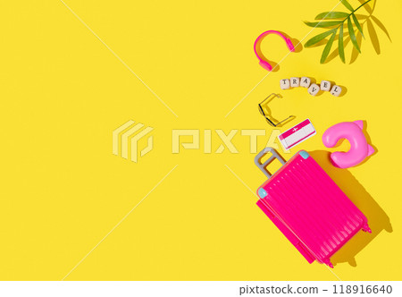 Flat lay pink toy suitcase with travel accessories on a yellow background. Travel concept. Flat lay pink toy suitcase with travel accessories on a yellow background. Travel concept. 118916640