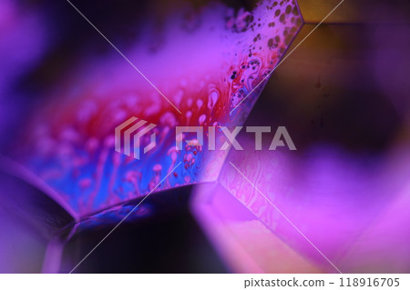 Purple liquid sphere, fluid sphere, plasma, fluid movement, orange planet on the dark background 118916705