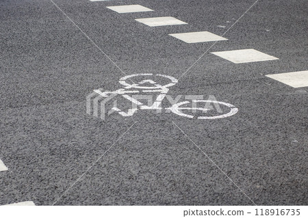 A bicycle lane is indicated by paint and located on the side of the road 118916735