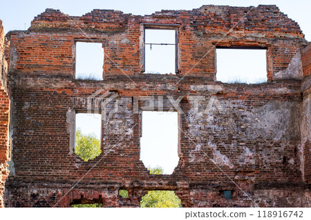 Interior of an old brick building, trees visible outside Interior of an old brick building, trees visible outside 118916742