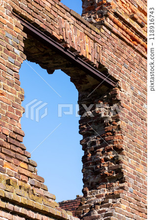 Interior of an old brick building, trees visible outside Interior of an old brick building, trees visible outside 118916743