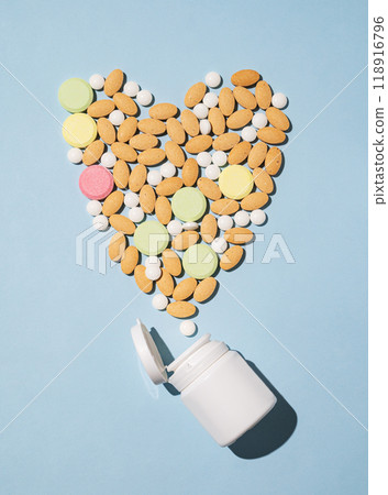 A variety of pills and nutritional supplements of different colors dynamically pour out A variety of pills and nutritional supplements of different colors dynamically pour out 118916796