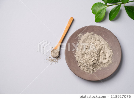 Dry blue clay on a light background. Concept for preparing homemade skincare organic cosmetics. 118917076