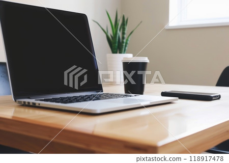 Minimalist Workspace with Laptop, Smartphone, and Coffee Cup for Productive Atmosphere and Tech Efficiency Minimalist Workspace with Laptop, Smartphone, and Coffee Cup for Productive Atmosphere and Tech Efficiency 118917478