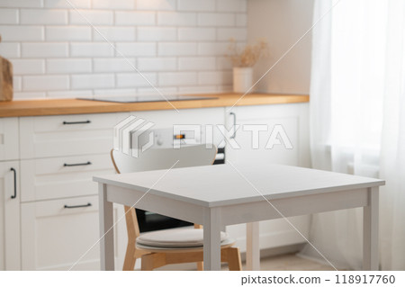 Empty wooden table with free space for product montage or mockup and chair Empty wooden table with free space for product montage or mockup and chair 118917760