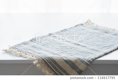 Wooden white empty tabletop with hanging napkin close up Wooden white empty tabletop with hanging napkin close up 118917795