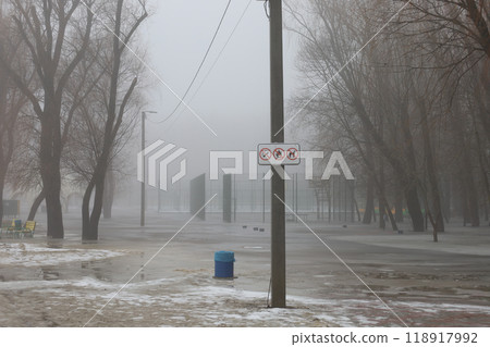 Flooded park, heavy fog, Chernihiv Ukraine, Winter foggy park atmosphere Flooded park, heavy fog, Chernihiv Ukraine, Winter foggy park atmosphere 118917992