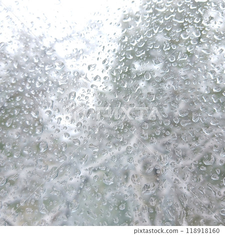 frozen drops of rain or wet snow on the window glass frozen drops of rain or wet snow on the window glass 118918160