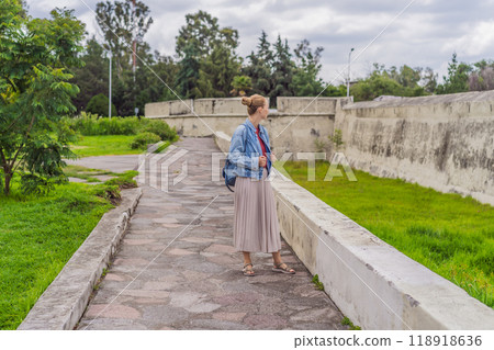 Female tourist exploring the Loreto Fort Museum in Puebla, Mexico. Cultural heritage, history, and travel exploration concept 118918636