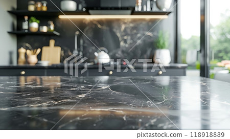 A kitchen with a marble countertop and a black stove 118918889