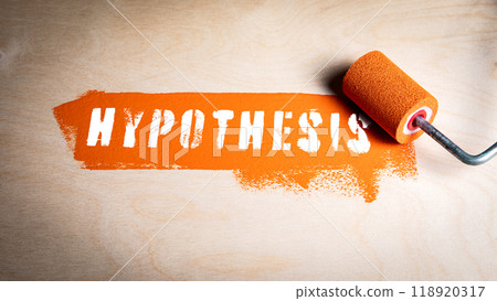 Hypothesis Concept. Orange paint and paint roller on wood texture background Hypothesis Concept. Orange paint and paint roller on wood texture background 118920317