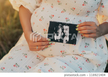 Happy Mother Carrying Child, Expecting For Baby. Demonstrating Ultrasound Shot. Amazing Motherhood 118921404