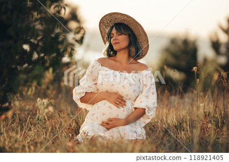 Happy Mother Carrying Child, Expecting Baby. Amazing Motherhood. Pregnant Woman Happy Mother Carrying Child, Expecting Baby. Amazing Motherhood. Pregnant Woman 118921405