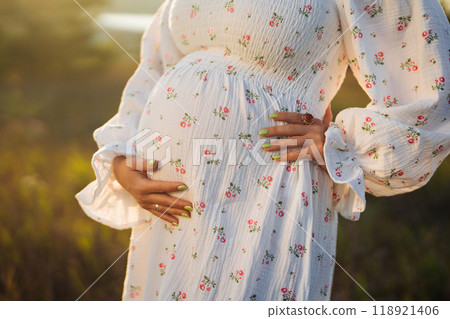 Happy Mother Carrying Child, Expecting For Baby. Amazing Motherhood. Pregnant Woman in beautiful Happy Mother Carrying Child, Expecting For Baby. Amazing Motherhood. Pregnant Woman in beautiful 118921406
