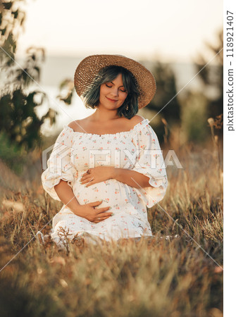 Happy Mother Carrying Child, Expecting Baby. Amazing Motherhood. Pregnant Woman Happy Mother Carrying Child, Expecting Baby. Amazing Motherhood. Pregnant Woman 118921407