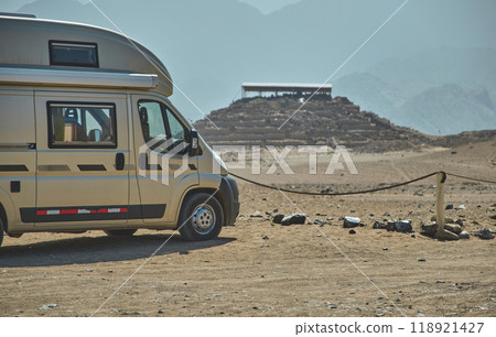 Young couple in camper exploring archaeological site of the Sacred City of Caral, Peru. 118921427
