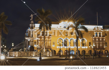 A large building with a fountain in front of it A large building with a fountain in front of it 118921455