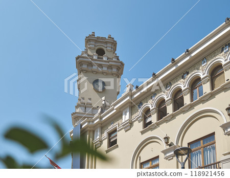 A tall building with a clock tower and a balcony. Municipality of Miraflores 118921456
