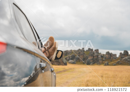 A person is laying down in the car. Huayllay Stone Forest, Peru. 118921572