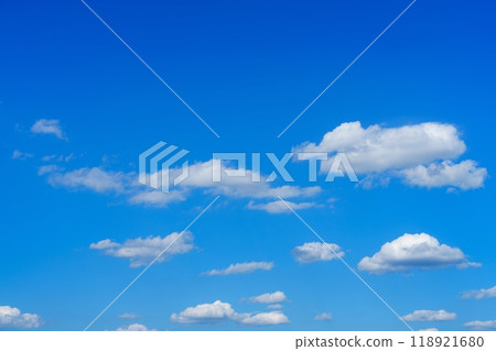 Vast and Beautiful Blue Sky with Fluffy White Clouds Perfect for Backgrounds and Designs Vast and Beautiful Blue Sky with Fluffy White Clouds Perfect for Backgrounds and Designs 118921680