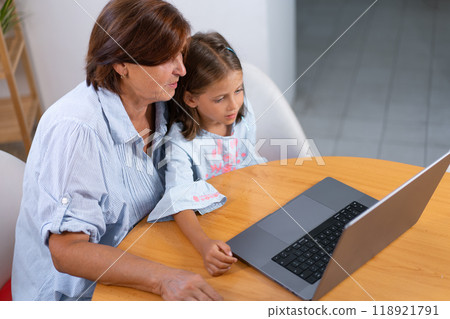 From above of granddaughter and grandmother using From above of granddaughter and grandmother using 118921791