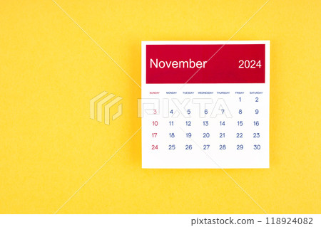 Calendar page November 2024 on yellow background. 118924082