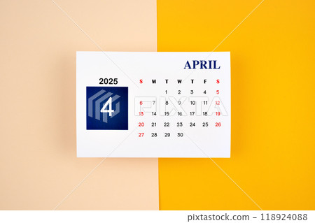 April Calendar 2025 page on yellow background. 118924088