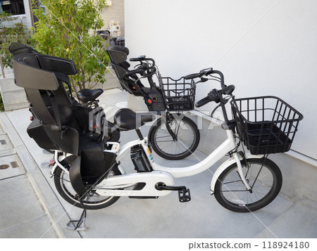 Electrically assisted bicycle with child seat 118924180