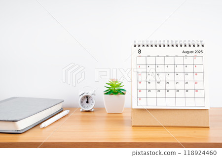 August 2025, Monthly desk calendar for 2025 year on wooden table. 118924460