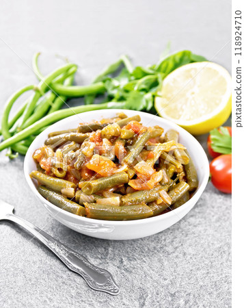 Beans green with vegetables in bowl on stone tabletop Beans green with vegetables in bowl on stone tabletop 118924710