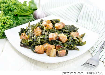 Kale cabbage with bacon in plate on board Kale cabbage with bacon in plate on board 118924735