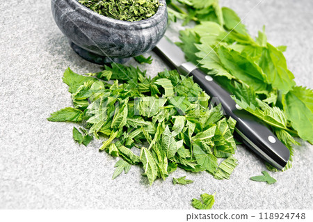 Nettle fresh cut on stone 118924748