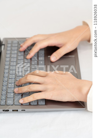 Business woman's hand operating a personal computer Business woman's hand operating a personal computer 118926038