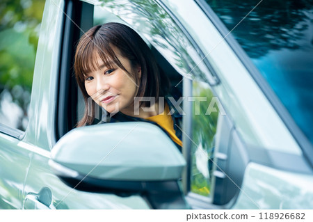 Woman in a car, woman going for a drive 118926682