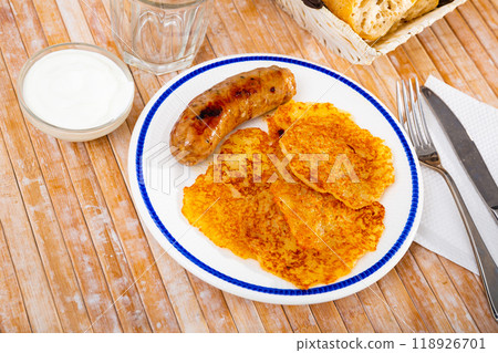 Potato pancakes with sausage and sour cream 118926701