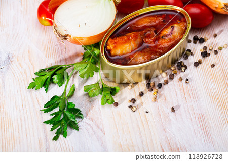 Canned stuffed squids in American sauce 118926728