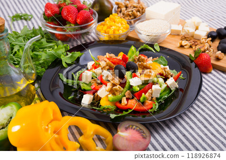 Ingredients for salad from arugula and vegetables 118926874