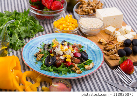 Plate with ready-made salad and its ingredients for recipe Plate with ready-made salad and its ingredients for recipe 118926875