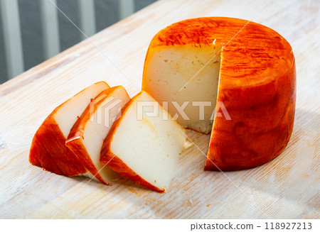Image of goat cheese with pepper on wooden desk 118927213
