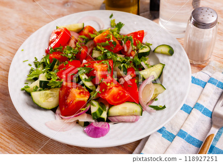 Fresh salad with cucumbers, tomatoes and onion Fresh salad with cucumbers, tomatoes and onion 118927251