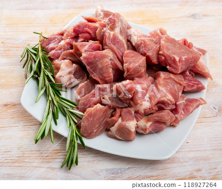 Raw pork neck meat cuts, top view on wooden background Raw pork neck meat cuts, top view on wooden background 118927264