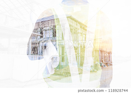Double exposure image of professional engineer in protective helmet and blueprints paper at building construction site Double exposure image of professional engineer in protective helmet and blueprints paper at building construction site 118928744